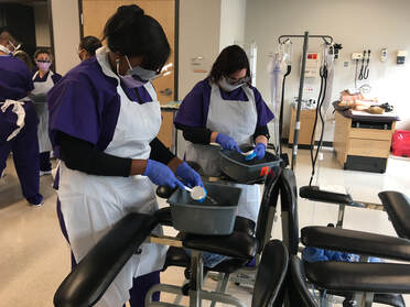 Medical Assistant Students working on hand washing techniques in the lab